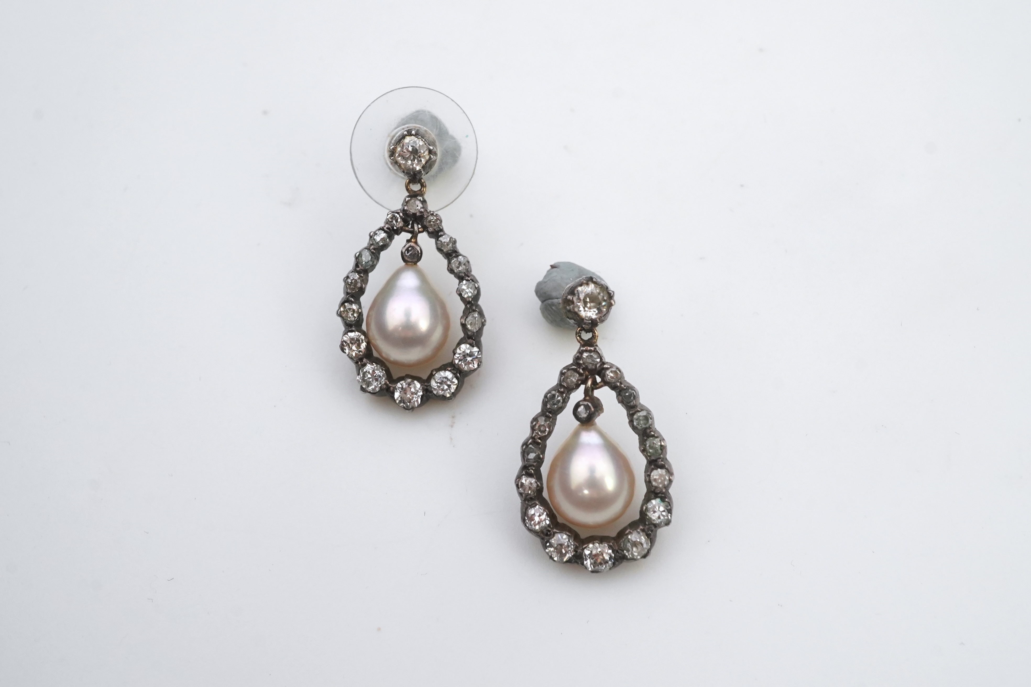 A pair of cultured pearl and diamond earrings